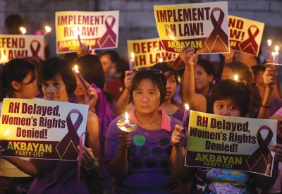 RH Bill supporters hold a vigil outside the Philippines Supreme Court in March to protest the delay in implementing the law signed in December by President Benigno Aquino III.