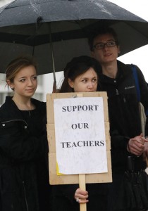 Sacred Heart Cathedral Preparatory students Julie Cravotto, center, and Nick LoGrasso, right, join a student vigil at St. Mary’s Cathedral in San Francisco after the release of a new faculty handbook with restrictive morality requirements for archdiocesan schools.