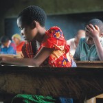 Students write at their desks at a primary school in Mt. Kilimanjaro, Tanzania.