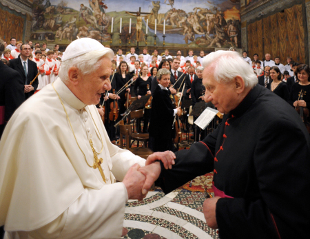 Emeritus Pope Benedict XVI (left) is pictured with his older brother, Msgr. Georg Ratzinger, at a 2009 concert by the Regensburger Domspatzen, once directed by the elder Ratzinger, where abuse accusations have recently surfaced. © REUTERS/OSSERVATORE ROMANO
