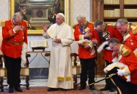 Pope Francis, flanked by members of the Order of Malta, addresses the recently ousted Grand Chancellor of the Order, Albrecht von Boeselager. © Getty Images
